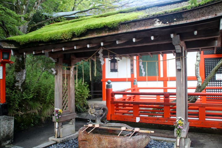 a hand washing pavilion, and a building in the background with orange trim, thumbnail