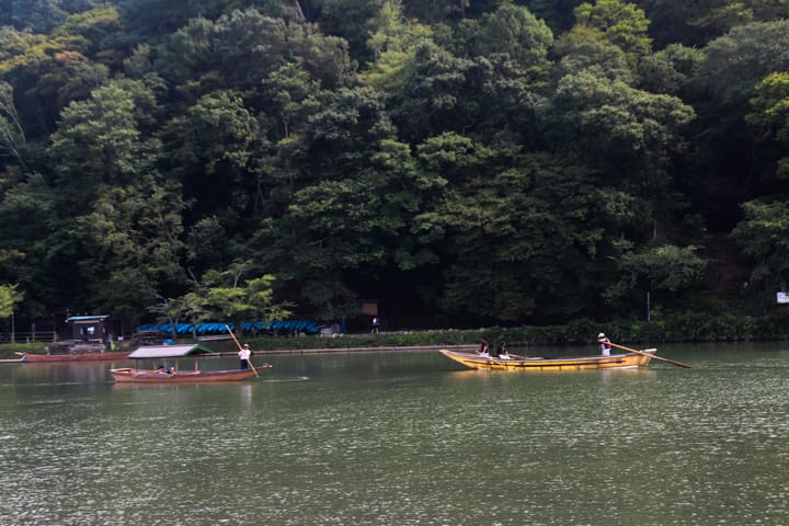a lake view with two boats passing by each other going opposite directions, thumbnail