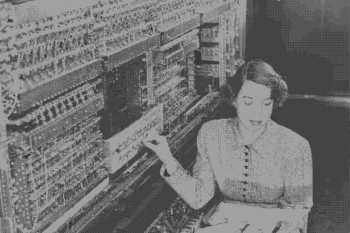 woman programming super computer, wires exposed and circuits are visible, pixelated thumbnail