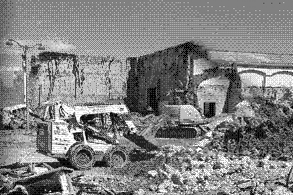 heavy machinery, piles of rocks and concrete, and half demolished building, pixelated