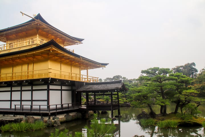 a close up view of the golden temple, kikakuji, against a murky sky, thumbnail